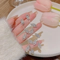 Silver leaf tassel earrings with white zircon accents in a hand-held elegant view - Silver Leaf Full Zircon Long Dangle (E0094 Silver)