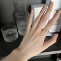 Adjustable 925 sterling silver ring with shimmering stones worn on model finger - Silver Micro-Inlaid (JZ0846)