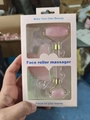 Macro view of pink quartz face roller and heart-shaped gua sha tool in gift box - Resin Style