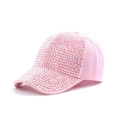 Close-up of pink cotton baseball cap with glittering rhinestones and adjustable strap - Pink