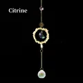 Golden suncatcher with citrine stones and crystal prism in a sun and moon design - Citrine