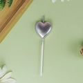 Metallic silver heart-shaped birthday candle with white stem on green background - Heart / Silver