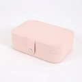 Pink faux leather jewelry box featuring a secure snap button closure and smooth edges - Light Pink
