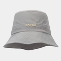 Close-up of grey waterproof bucket hat with gold GOOD DAY metal letter logo detail - Gray