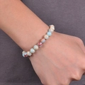 8mm natural stone beaded bracelet with blue and beige marble texture worn on wrist - Light Blue Shoushan Stone