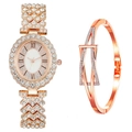 Detail of rose gold oval watch and crystal bracelet set with Roman numerals on white background - Watch+Bracelet / Rose Gold