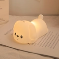 Silicone puppy night light in warm white, dog shaped lamp on a book for bedroom decor - Lying Dog (Battery-7 Colors)