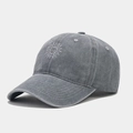 Detailed shot of grey washed cotton baseball cap featuring white sun embroidery and stitching - Adjustable / Gray