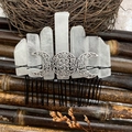 Macro detail of natural clear crystal hair comb with silver Triple Goddess moon symbol - White Crystal Black Wire Silver Moon