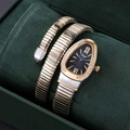 Detail of snake wrap watch with crystal-set bezel and gold-silver Tubogas band - Two Tone Case Black Dial