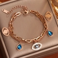 Pulsera de capas en acero oro rosa con ojo del diablo y colgante de gota azul - Rosa oro