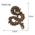 Detail view of vintage enamel dragon brooch with size 5.9x4.3cm and 18g weight - Antique Gold/Amber Rhinestone