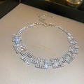 Detailed macro view of square link necklace featuring sparkling rhinestones and lobster clasp - Rhinestone Square / Silver