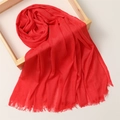 Detailed shot of soft red linen scarf with fringe edges draped over a wooden frame - 180*100cm / Bright Red (TH39-26)
