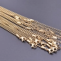 Detail of 2mm 18k gold-plated ball chains with lobster clasps and extension links - Gold