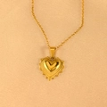 Macro shot of gold heart pendant with radial texture on elegant champagne background - Angular 3D Heart Radiating Necklace (45+5cm)
