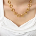 Minimalist gold plated titanium necklace featuring interlocking circles on a model - Necklace / 40+5cm / Gold