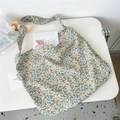 Detailed macro view of yellow floral canvas tote bag with rustic bohemian aesthetic - 16 Blue Base Small Yellow Flower