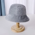 Gray plush bucket hat made of soft faux fur fabric on a wooden display stand - 56-58cm / Light Gray
