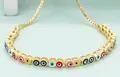 Adjustable golden bracelet with colorful evil eye charms in rainbow enamel finish - Multicolor