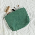 Green corduroy makeup bag with soft ribbed texture and zipper closure in Morandi style - Dark Green