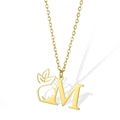 Gold stainless steel necklace with cutout letter M pendant featuring a leaf and face profile - Letter M