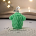 Green knit sweater scented candle with cotton wick and warm string lights background - Light Green Sweater - Grapefruit Sea