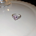 Adjustable silver ring with pink heart-shaped zircon and pave crystals on white tray - Pink Heart Ring Style