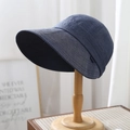 Close-up of dark blue denim sun hat with wide brim on a wooden stand showing mesh lining - M (56-58cm) Adjustable / Dark Blue
