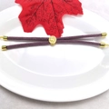 Detail of purple braided bracelet with gold tree of life charm on white tray - Light Purple