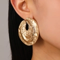 Chic golden chunky alloy stud earrings with hammered texture shown on model - Gold