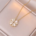 Macro detail of magnetic four-leaf clover necklace with crystals and white enamel petals - Gold Color Mother of Pearl Style (X1205)
