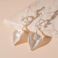 Close-up of matte silver leaf earrings with elegant pearls on a natural stone base - Silver Earring Post Style / Silver Heart Leaf Drop Earrings