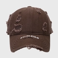 Close-up of distressed dark brown baseball cap with embroidery and frayed hole details - Coffee