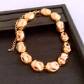 Macro shot of gold irregular pebble metal bracelet on black jewelry tray - 22# Gold Necklace Irregular Beads
