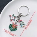 Silver Christmas keychain with Santa, tree and reindeer charms on white ceramic plate - ER829-White K Enamel Green Heart Reindeer Santa Tree Keychain