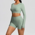 Sage green long sleeve yoga set detail showing thumbholes and side pocket on shorts - S / Basil Green