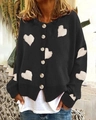 Detail of single-breasted black knit cardigan with white heart jacquard pattern - M / Tops / Black
