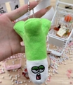 Close-up of a plush green onion keychain with an embroidered face and silver ball chain - Mixed Leek + Ball Chain