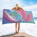 Vibrant mermaid tail beach towel held open on beach with sand and waves background - Dreamy Mermaid Scales (STJ-019-008)