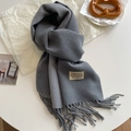 Double-sided grey faux cashmere scarf with fringe and vintage label on a table - 200x68cm / Dark Gray