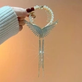 Pinza per capelli con ali dorate, perle e lunghe nappe di cristallo per donna - Oro
