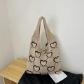 Beige knit tote bag featuring black heart jacquard pattern with stylish integrated handles - Khaki