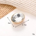 Macro shot of oval crystal gem charm with gold metal base and dimension details - C235 20*27 Oval Gem