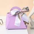 Elegant purple faux leather gift bag with printed silk scarf bow and gold ring detail - Purple
