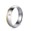 Macro shot of two-tone silver and gold plated titanium ring with a single inset diamond - US 6 / Two-tone with Zirconia