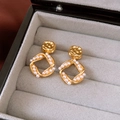Macro detail of 18K gold plated square earrings with pearls in a velvet jewelry box - 925 Silver Needle Pair / Gold
