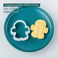 Gingerbread man cookie cutter tool with 5.2x6cm dimensions and finished biscuit - Gingerbread Man Outline Cutter