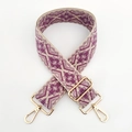 Close-up of geometric jacquard shoulder strap with gold metal hooks and adjustable buckle - Light Purple Dark Purple Floral