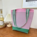 Detailed knit shoulder tote bag with pink and green houndstooth pattern on a table - 23 Small N Pink